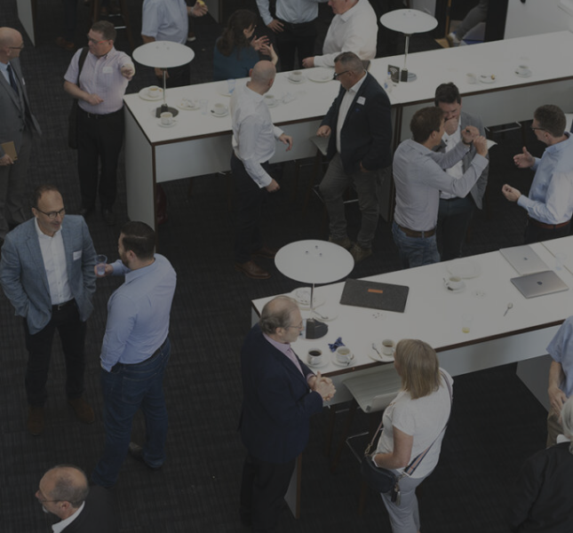 Group 114 People talking to each other at a networking event